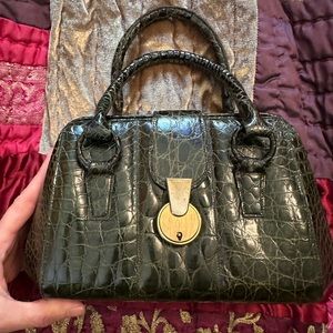 Crocodile green handbag it’s vintage.